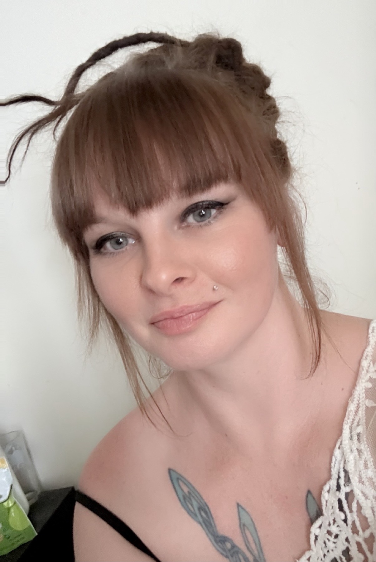 Alisia, loctician and graffiti artist behind Rooted Raven Studio