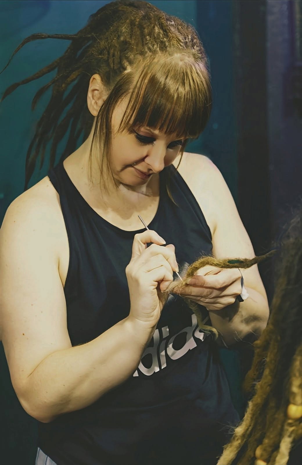 Alisia crocheting a loc