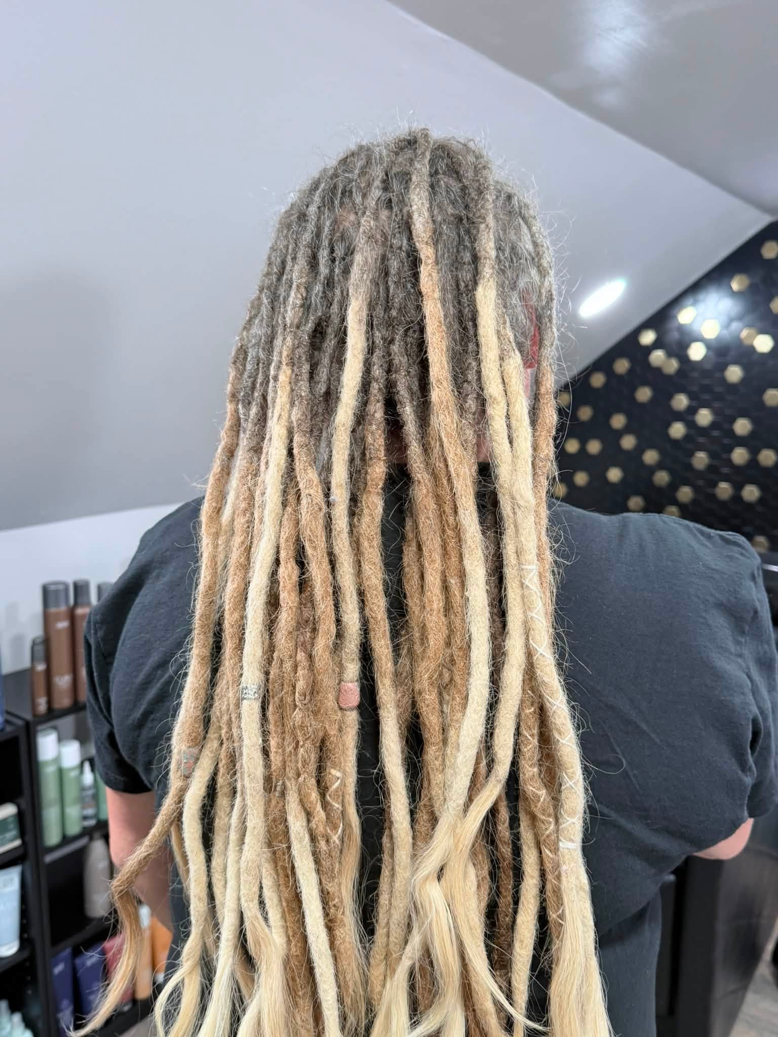 Back view of long blonde and brown locs