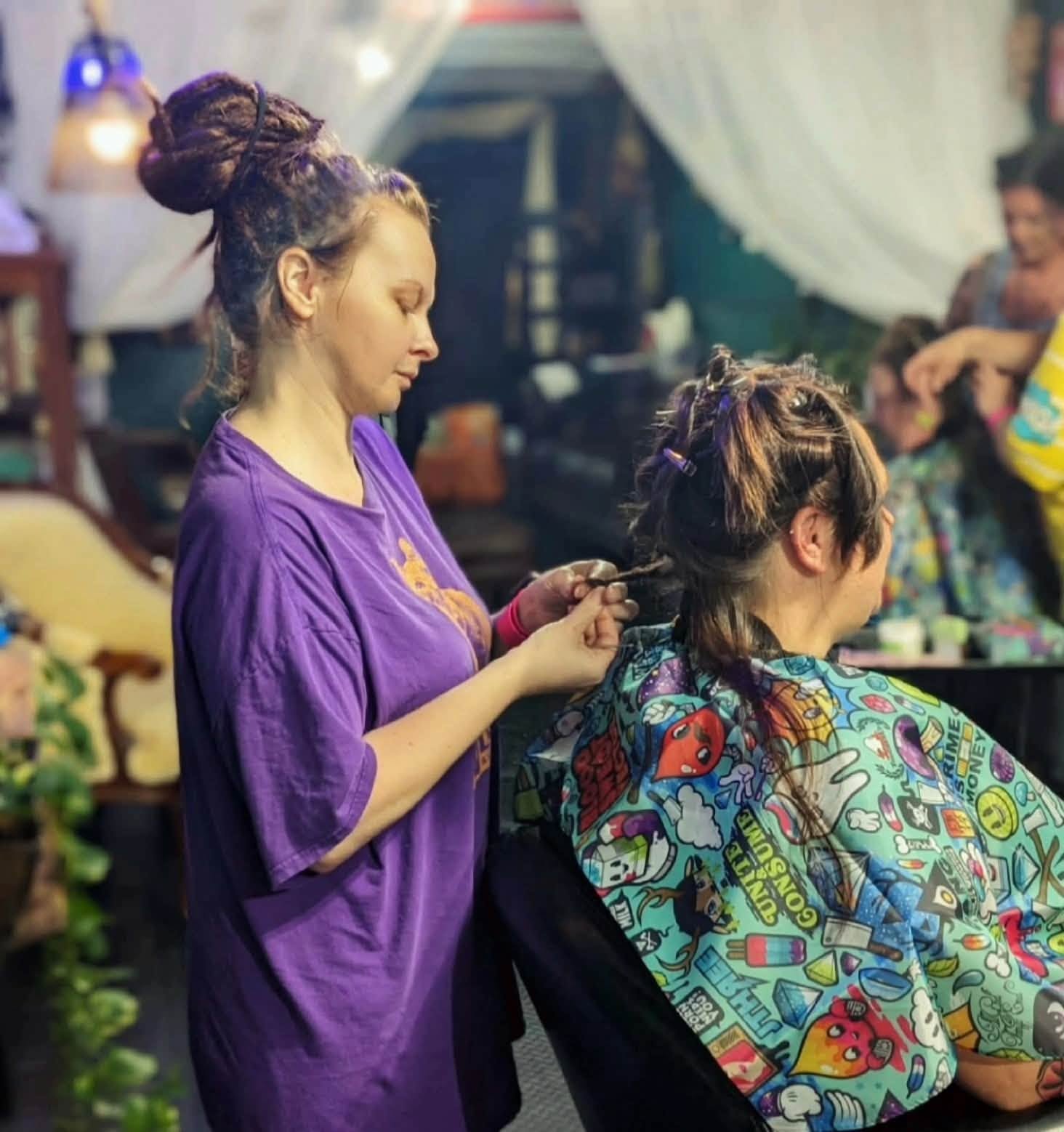 Alisia working on a client's hair